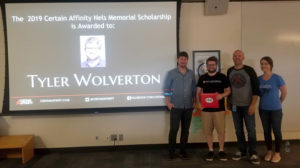 Certain Affinity presenting award to Tyler Wolverton